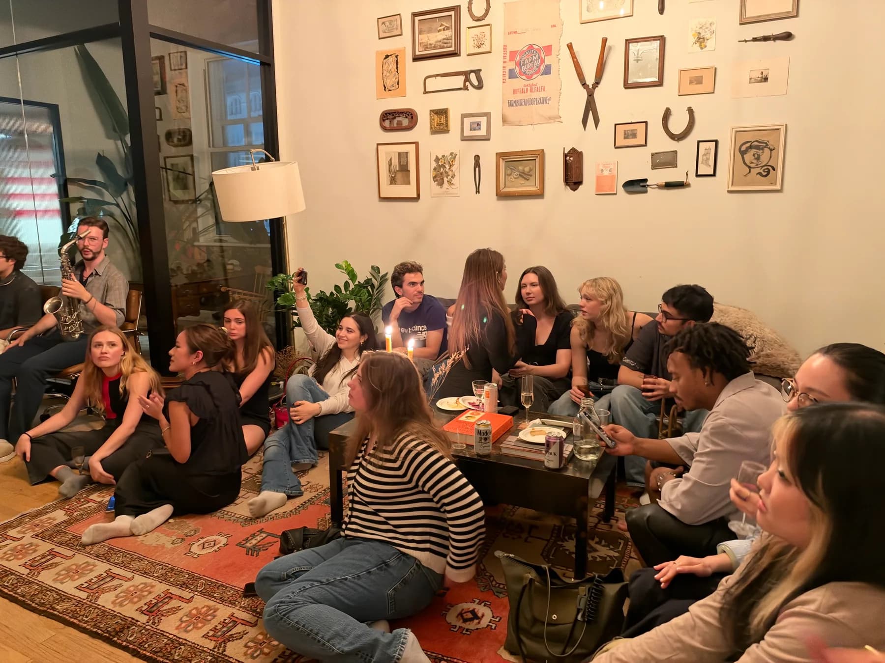 Colleagues gathered around a jazz musician during an office jazz night